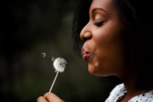 woman smelling flower